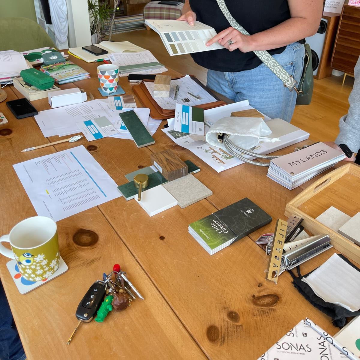 Alex from Aspect Renovations reviewing material samples and design plans