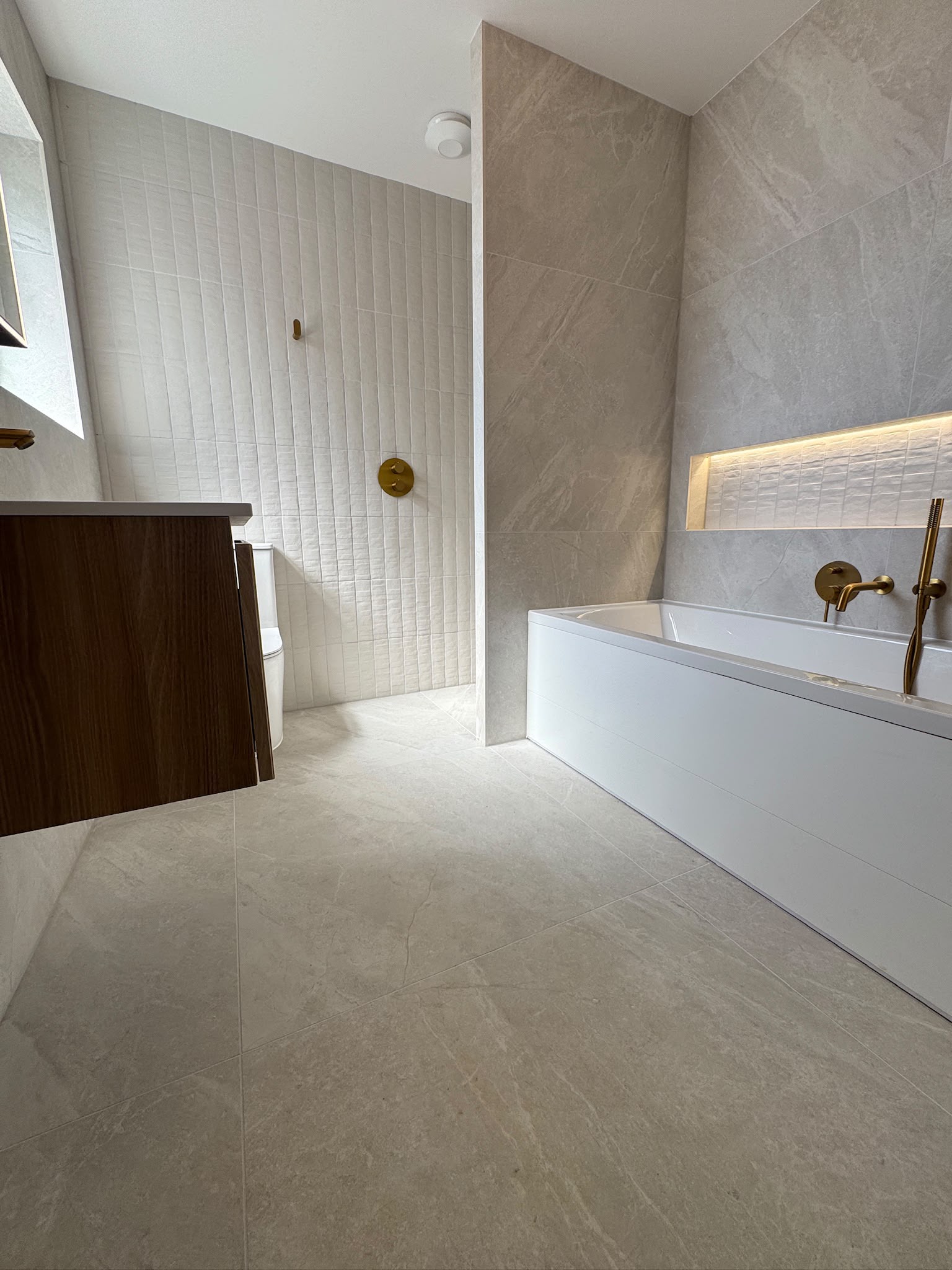 Family bathroom with walk-in shower, bath and floating vanity