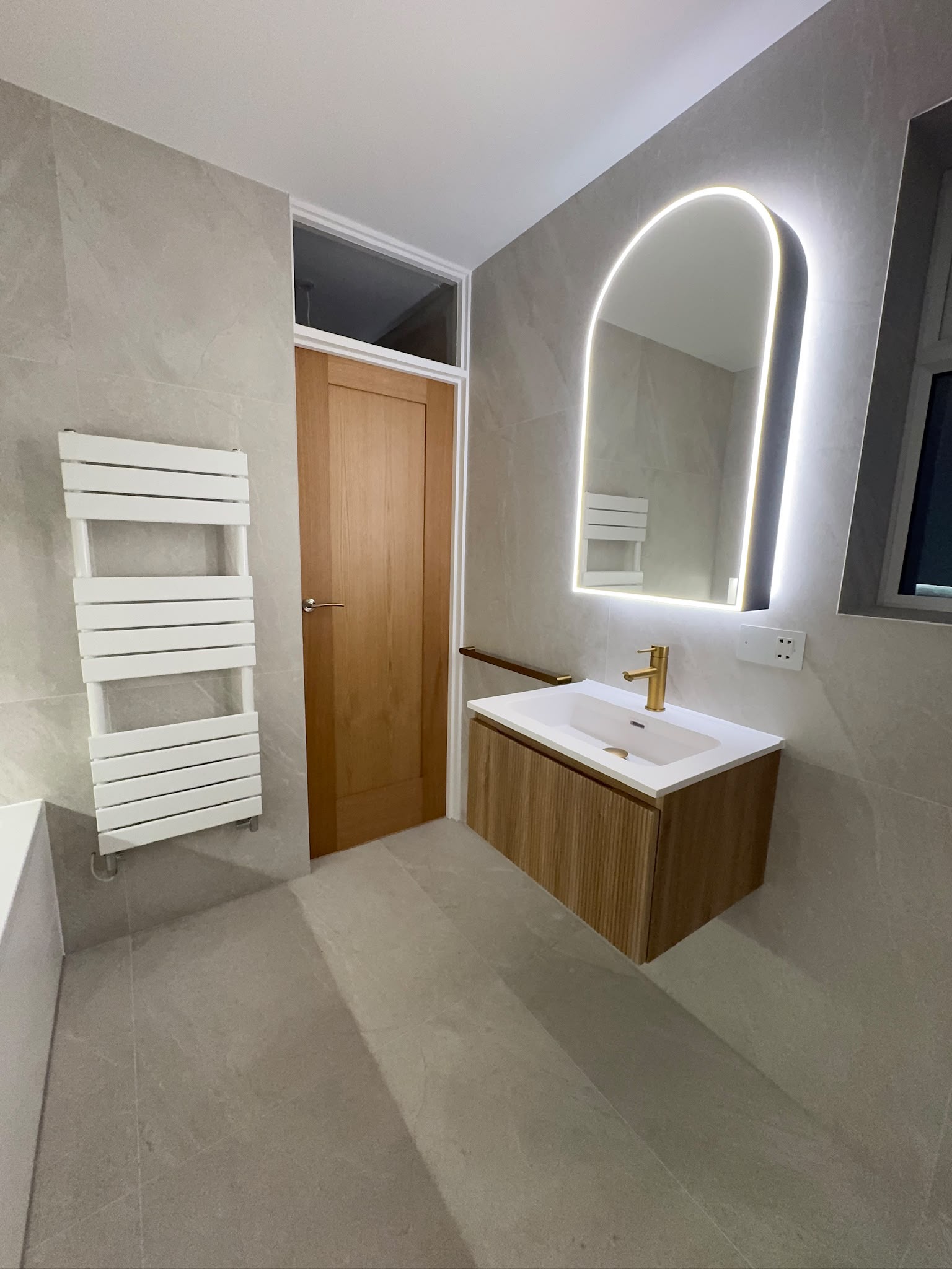 Floating vanity, mirror and towel radiator