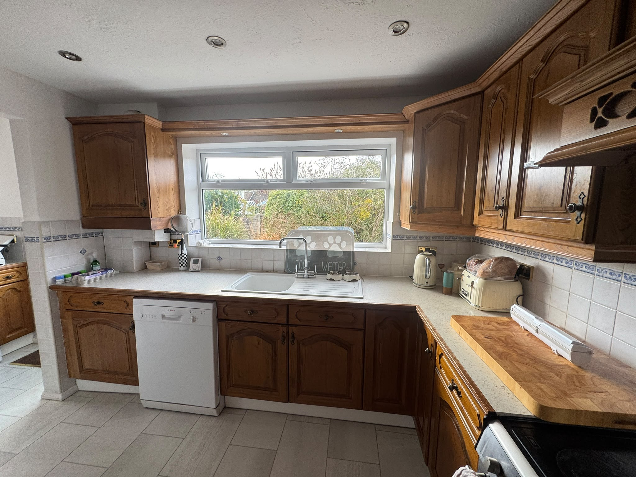 Before: the dated, enclosed kitchen