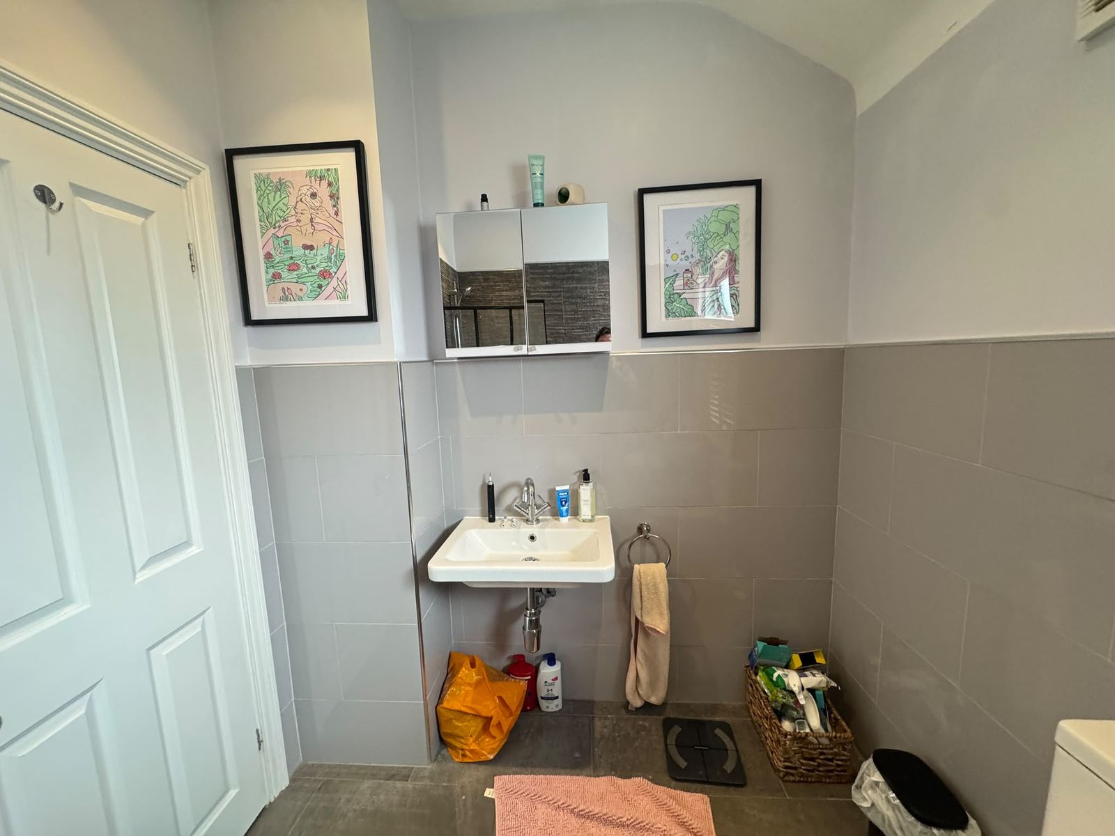 Before: pedestal basin and grey half-tiled walls
