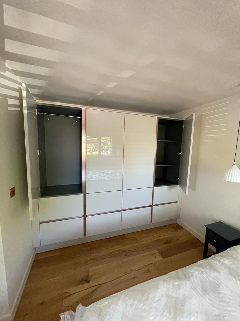 The wardrobes with their doors open