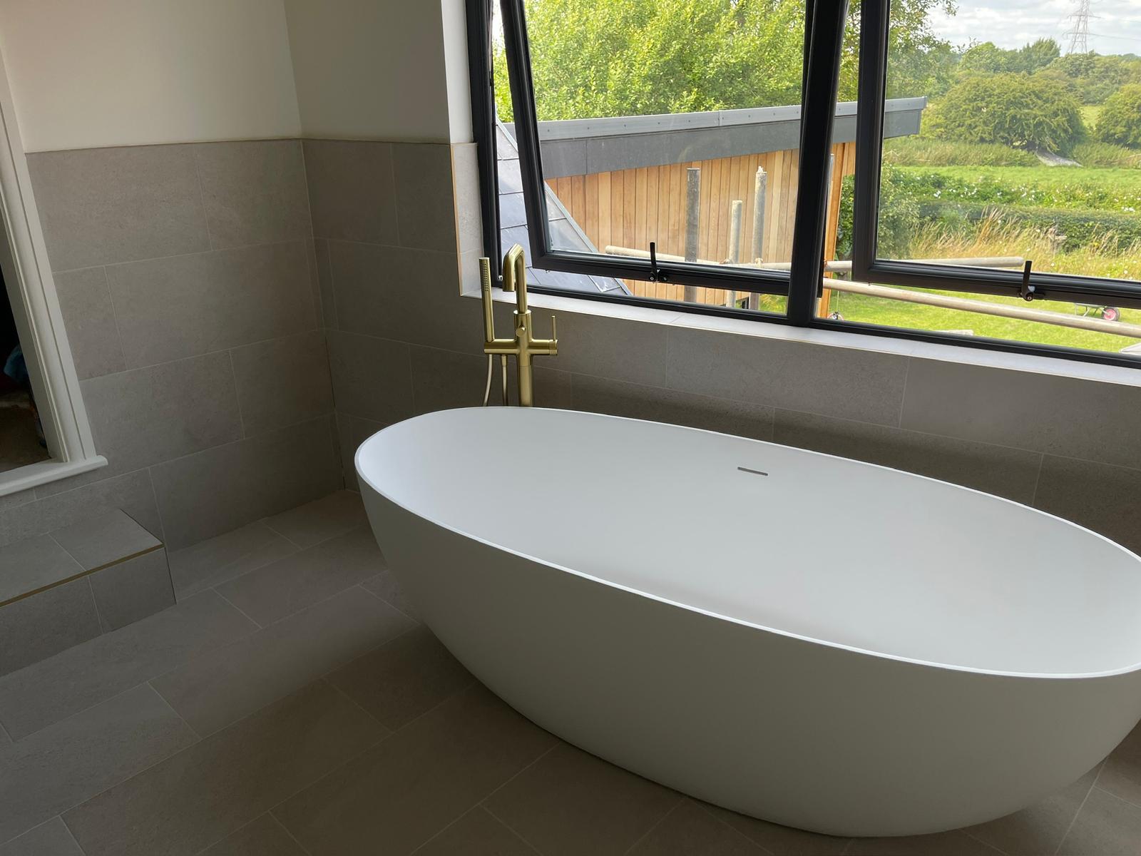 Renovated bathroom with freestanding bath