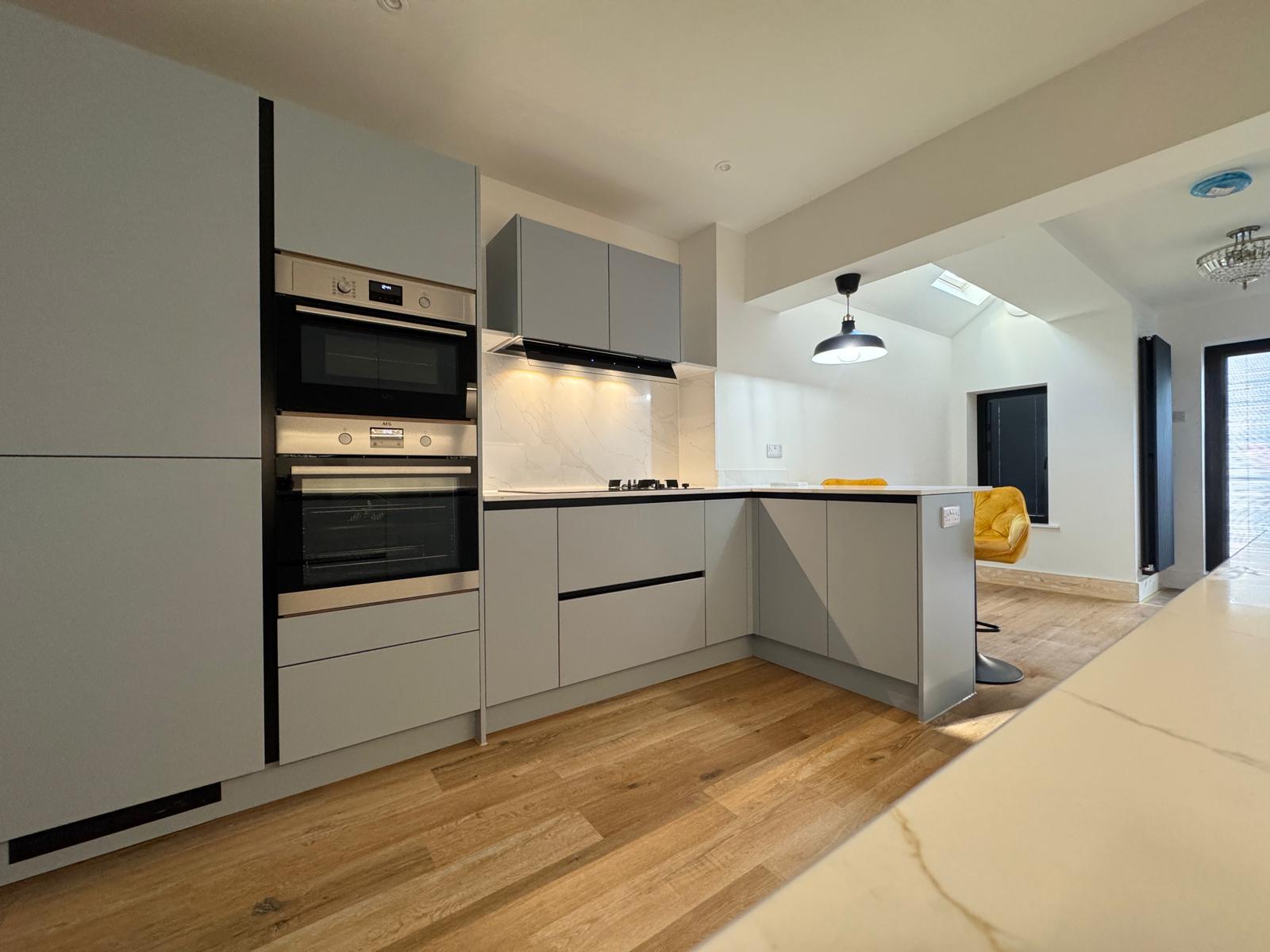Modern kitchen renovation with pendant lighting by Aspect Renovations