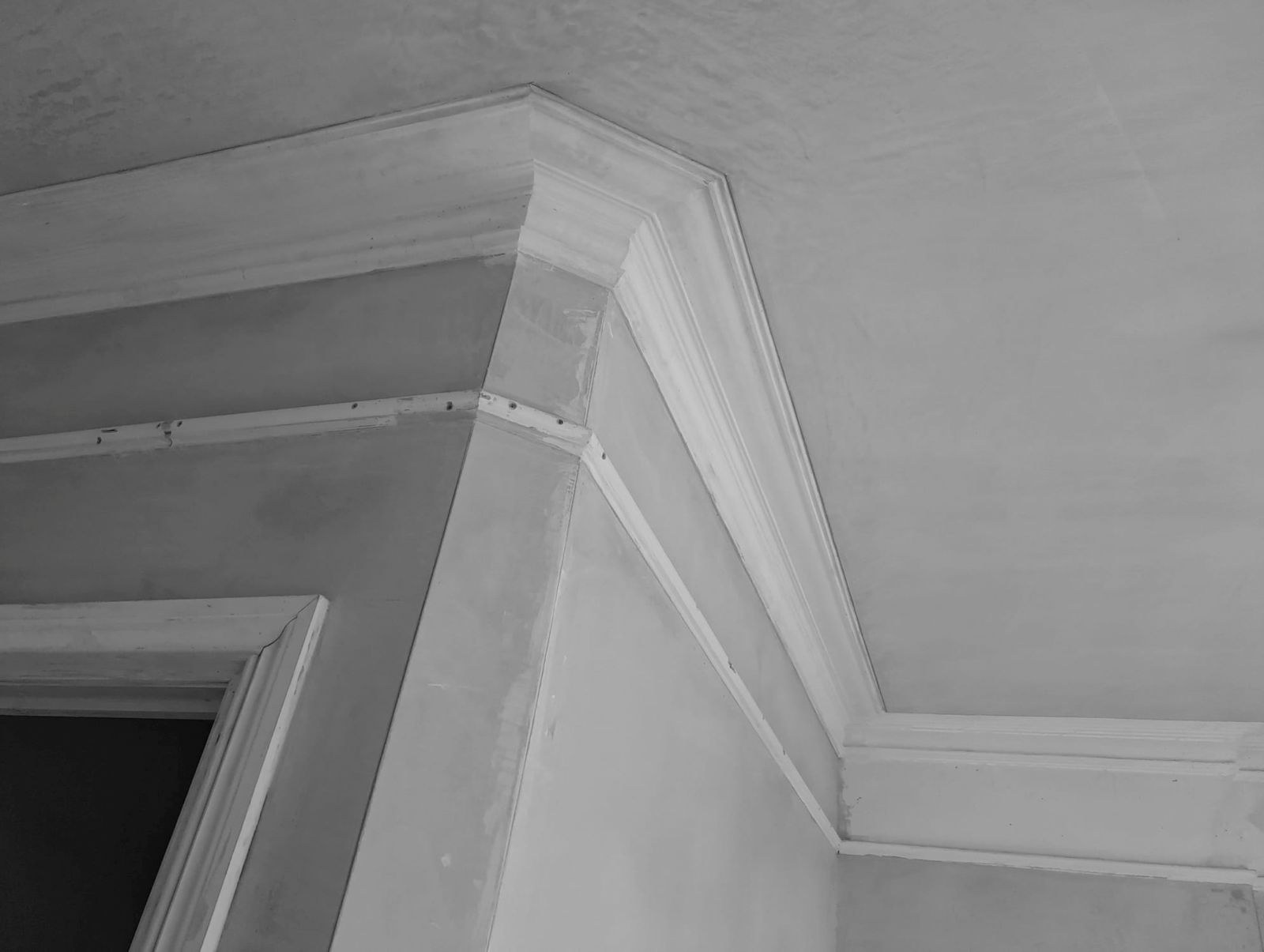 The same corner with the cornice reinstated and finished