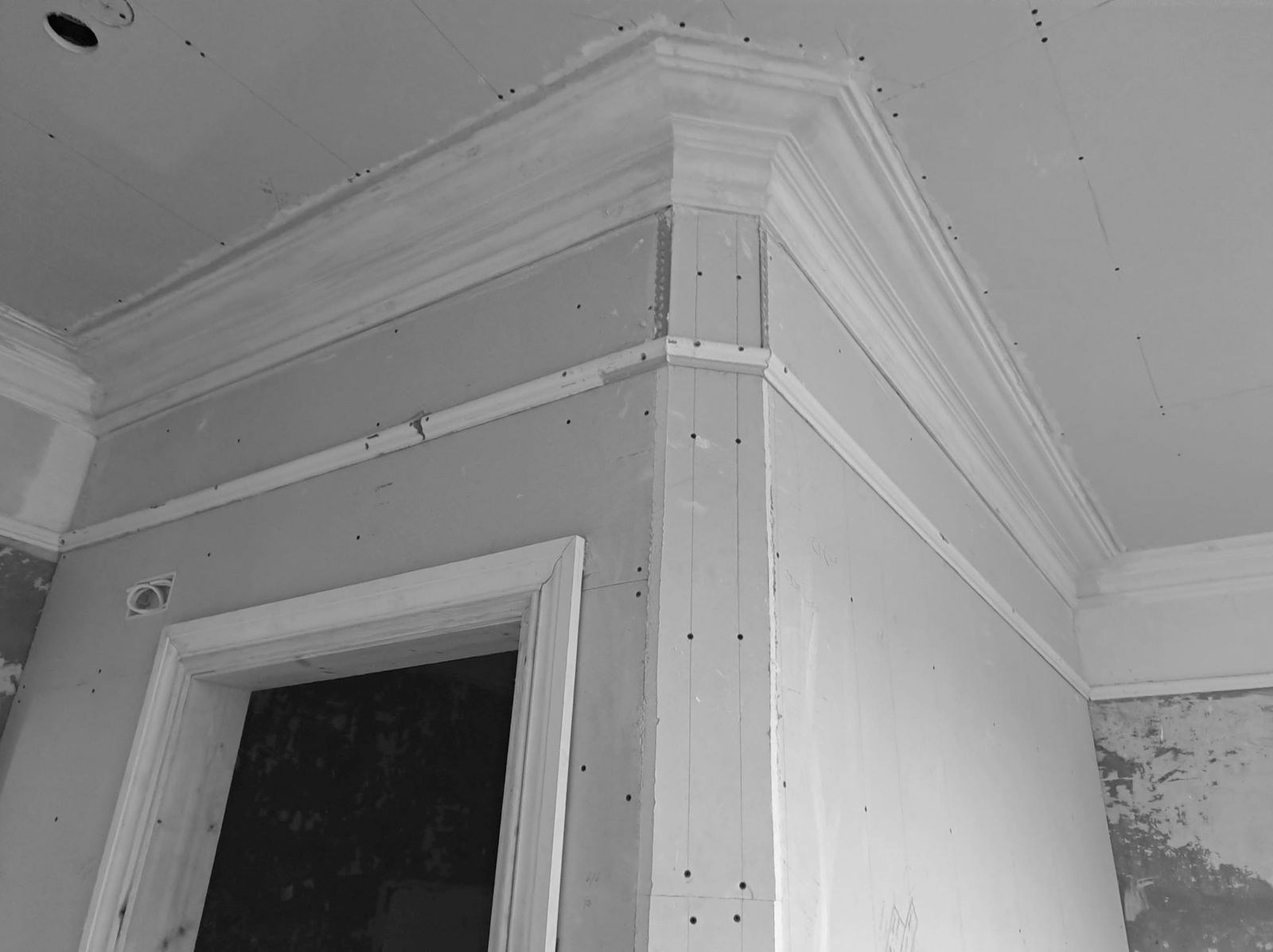 Cornice run continued around the corner on new plasterboard