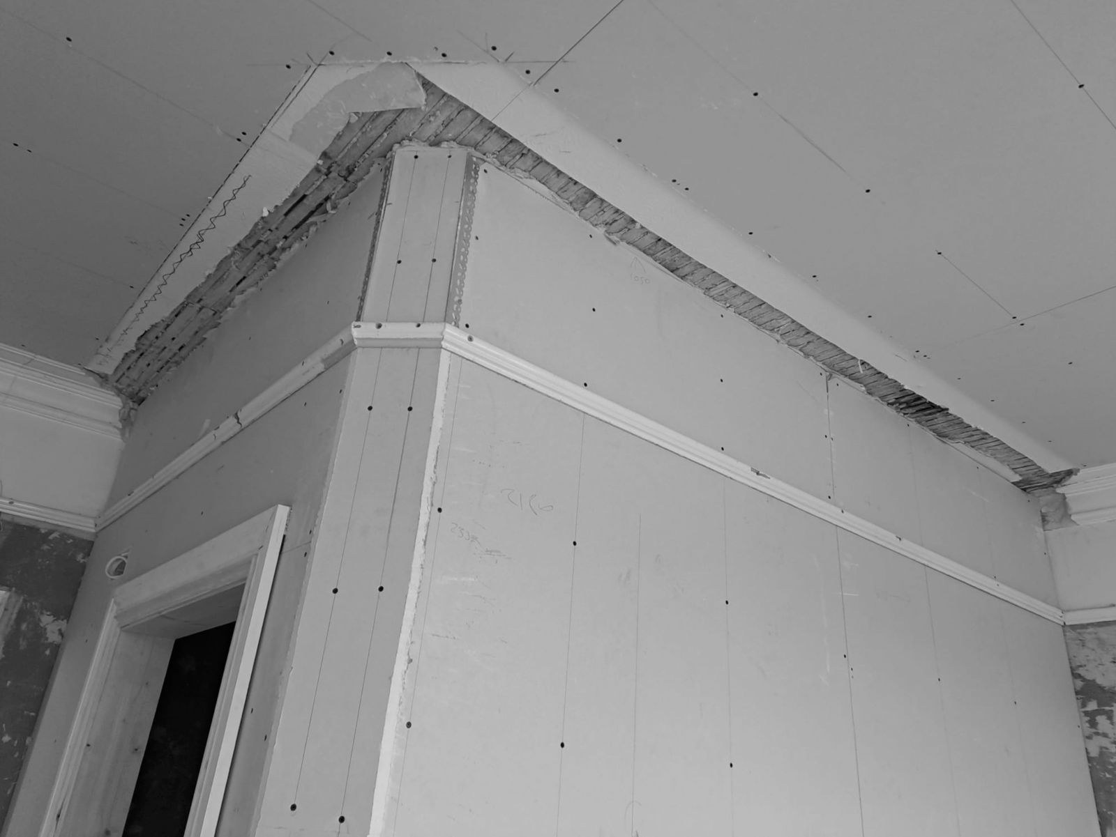 A boxed corner with the cornice cut back before restoration