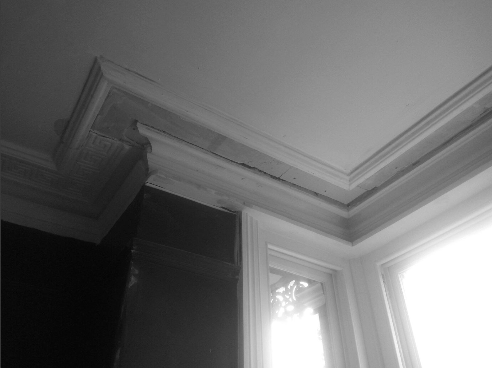 New section of Greek key cornice run in to match the original